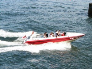 red and white recreational boat on the water