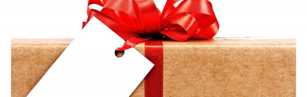 present wrapped in brown paper tied with a big red bow