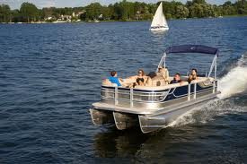 family enjoying a pontoon ride on a sunny day
