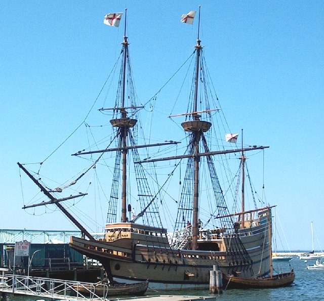 a replica of the Mayflower at a dock
