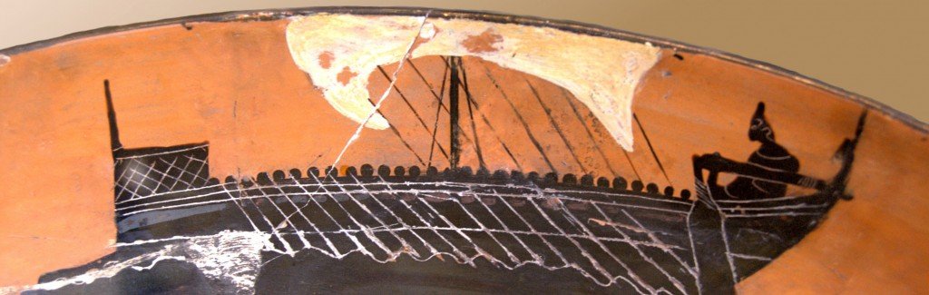 piece of ancient pottery showing a large boat with a white sail