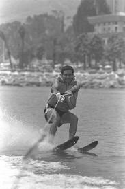 black and white image of a man waterskiing