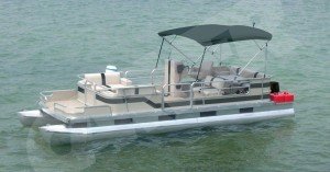 partially enclosed pontoon with black bimini top on the water