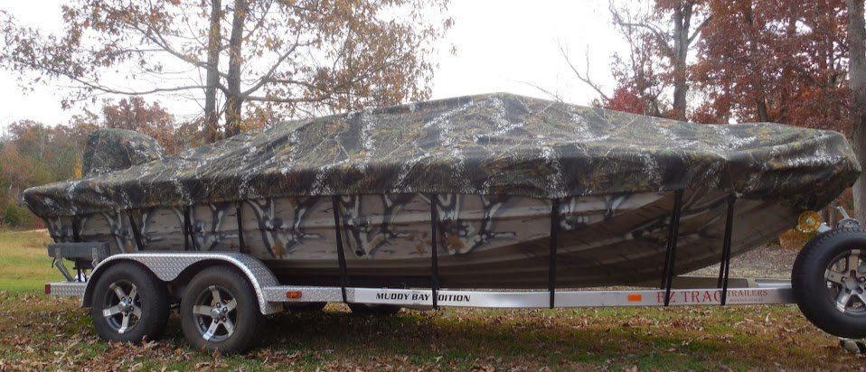 camo boat covered with a camo cover