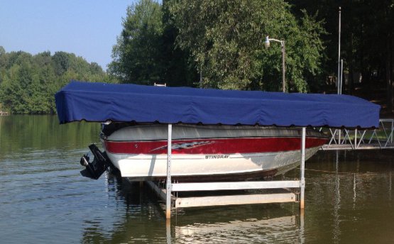 Stingray boat with a blue lift canopy - Lake Bowen, SC