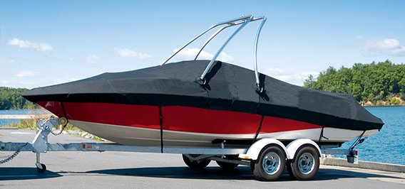 A Moomba boat with a black Carver boat cover